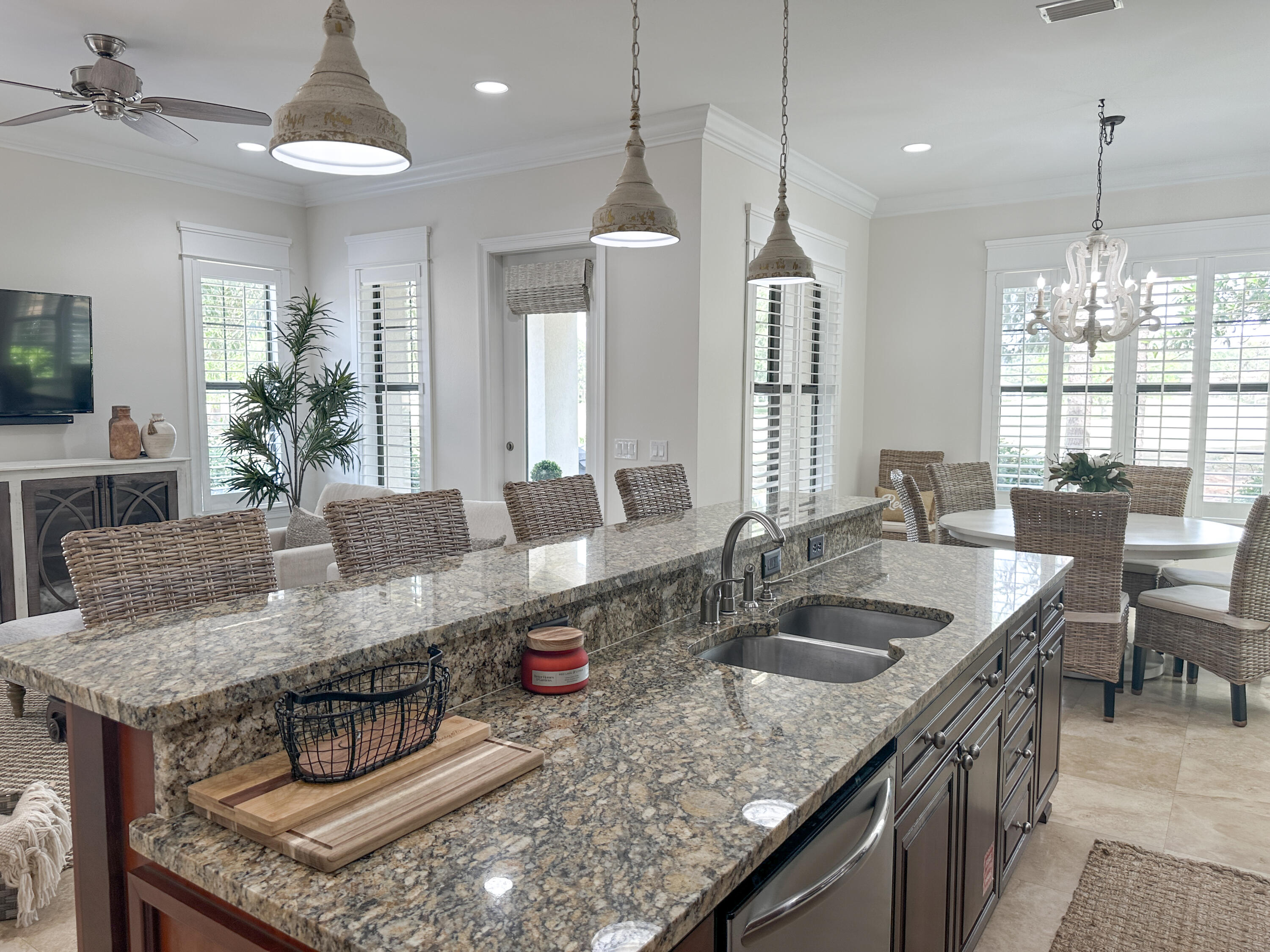 1893 Baytowne Loop Miramar Beach, FL 32550 - Photo 22 of 58 a kitchen with granite countertop a sink a counter top space appliances and living room view