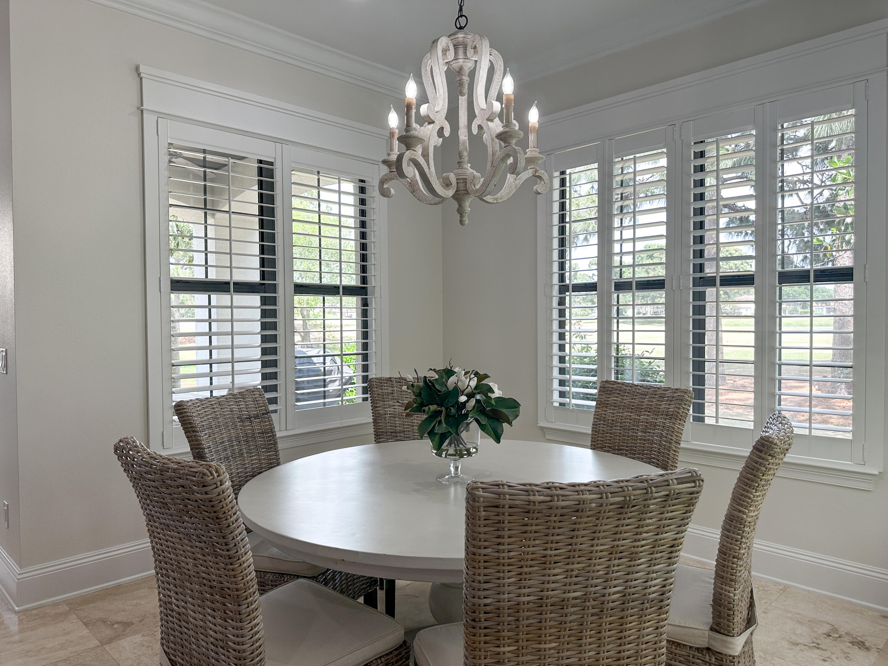 1893 Baytowne Loop Miramar Beach, FL 32550 - Photo 23 of 58 a dining room with furniture a large window and wooden floor