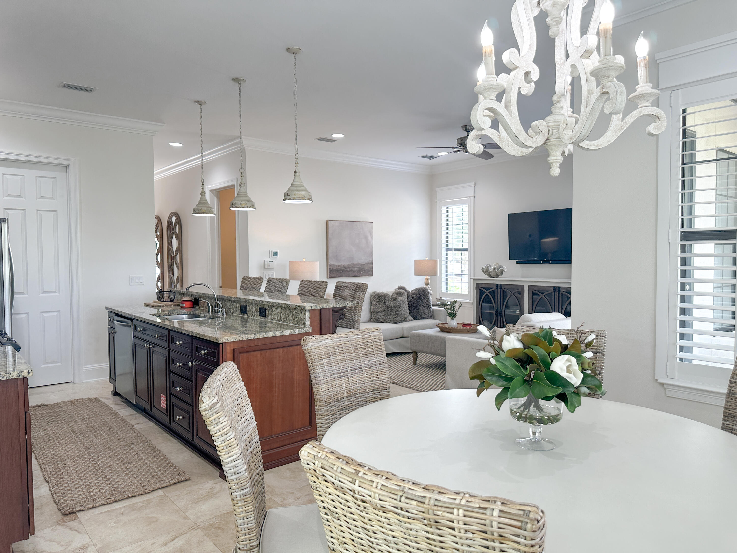 1893 Baytowne Loop Miramar Beach, FL 32550 - Photo 25 of 58 a kitchen with kitchen island granite countertop a sink a counter top space and living room view