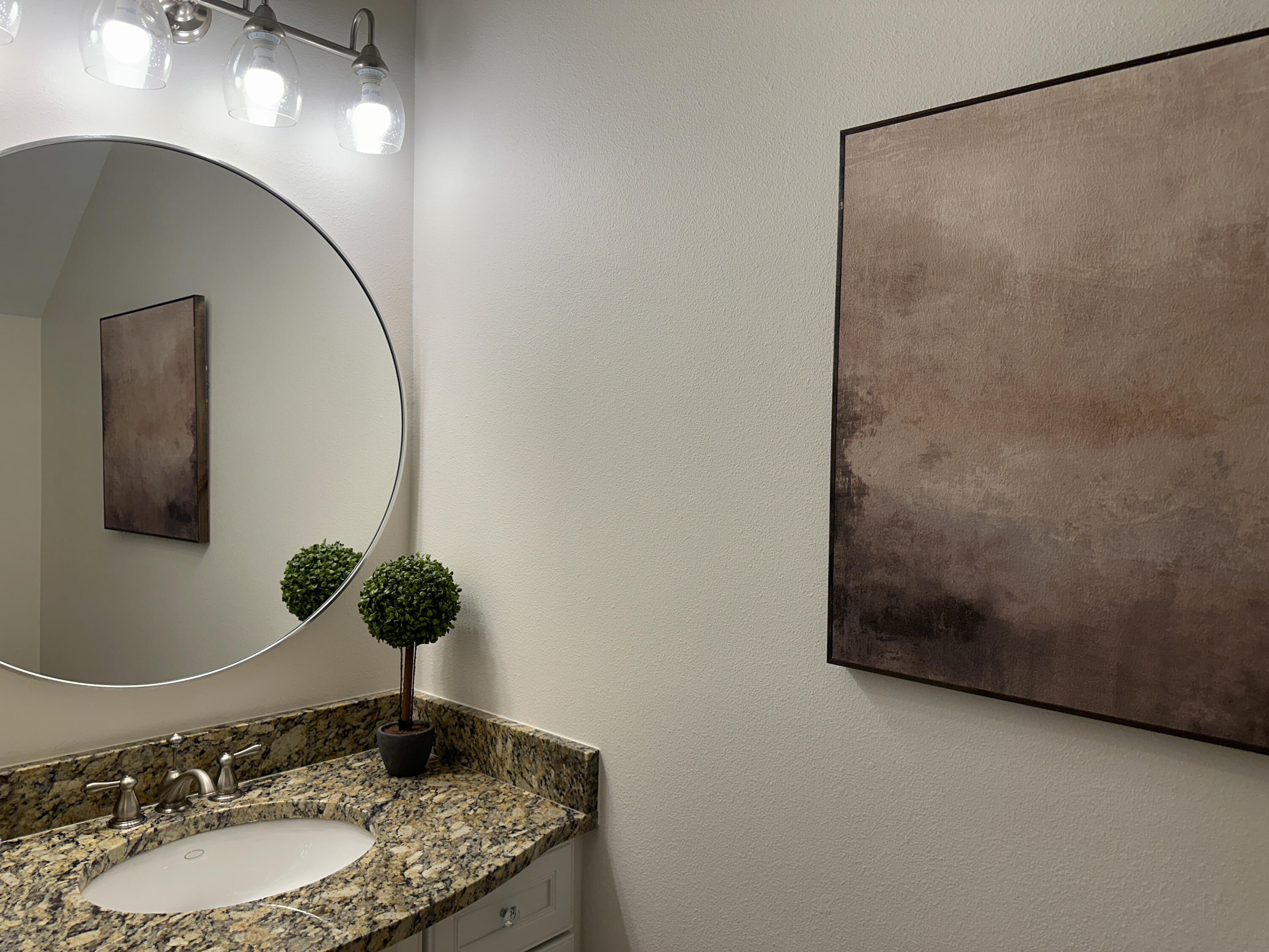 1893 Baytowne Loop Miramar Beach, FL 32550 - Photo 28 of 58 a bathroom with a granite countertop sink and a mirror
