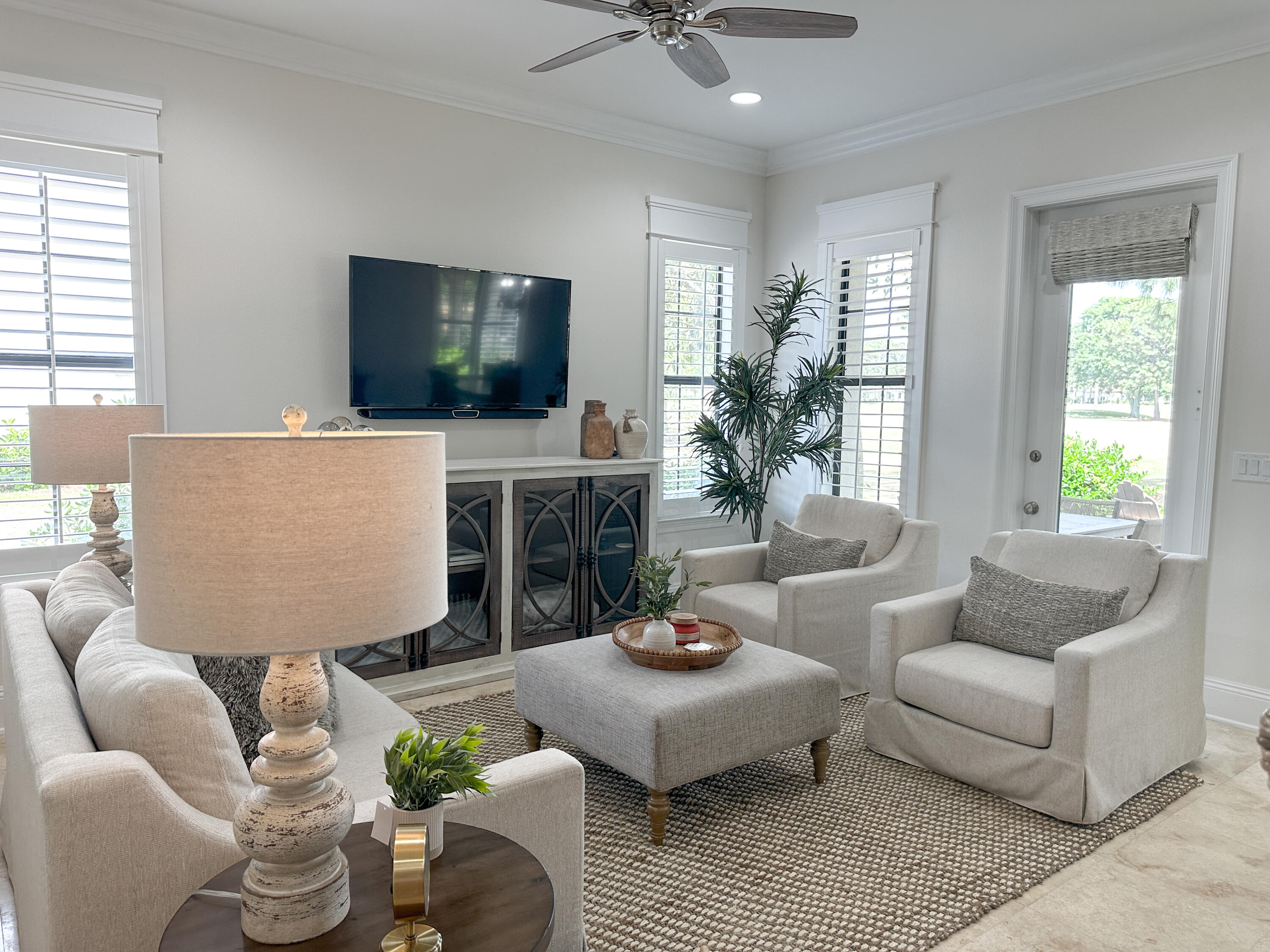 1893 Baytowne Loop Miramar Beach, FL 32550 - Photo 3 of 58 a living room with furniture a flat screen tv and a large window