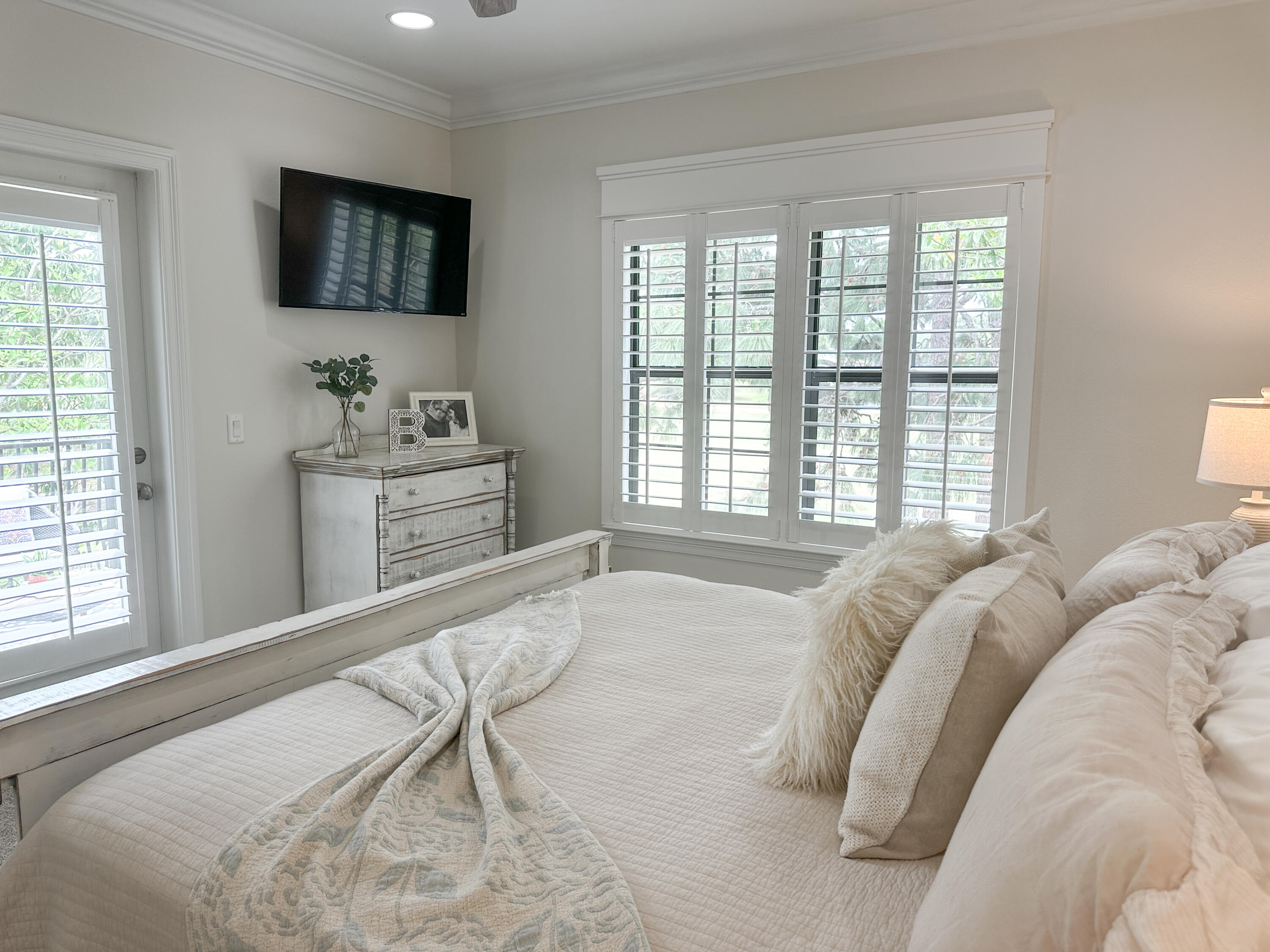 1893 Baytowne Loop Miramar Beach, FL 32550 - Photo 34 of 58 a spacious bedroom with a bed and a flat screen tv