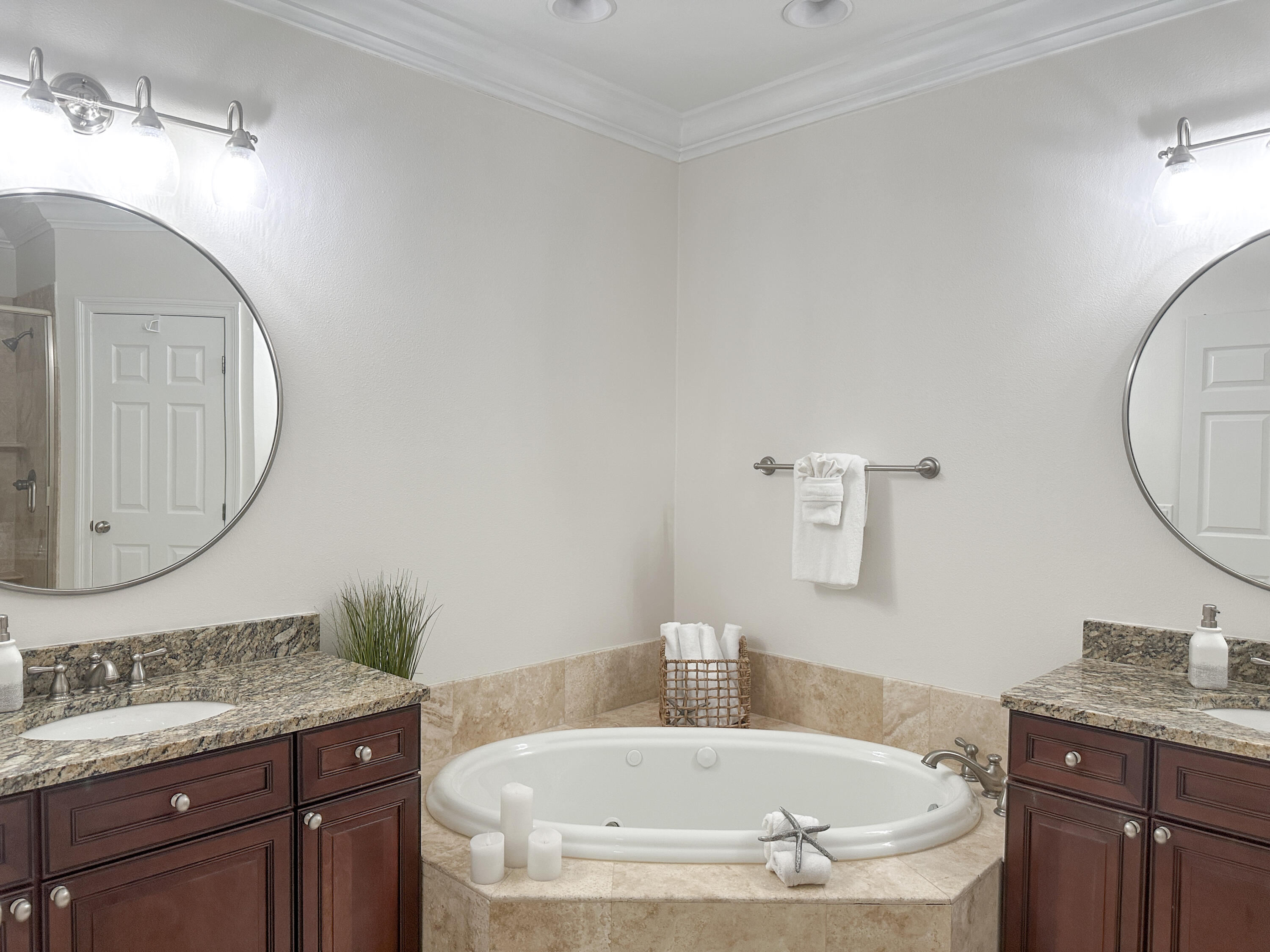 1893 Baytowne Loop Miramar Beach, FL 32550 - Photo 36 of 58 a bathroom with a granite countertop sink a mirror and bathtub