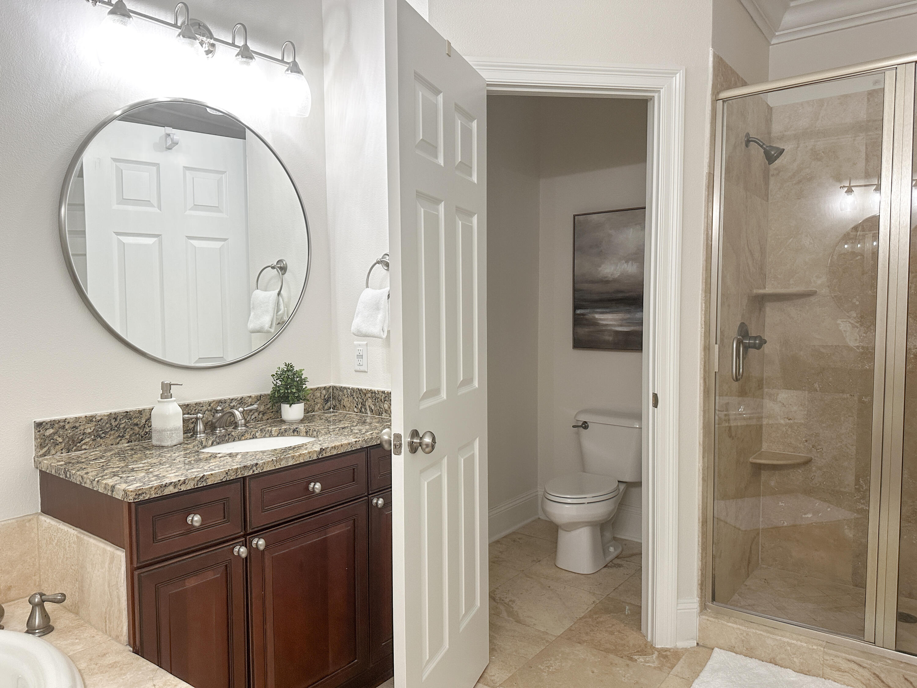 1893 Baytowne Loop Miramar Beach, FL 32550 - Photo 38 of 58 a bathroom with a granite countertop sink a toilet and a mirror