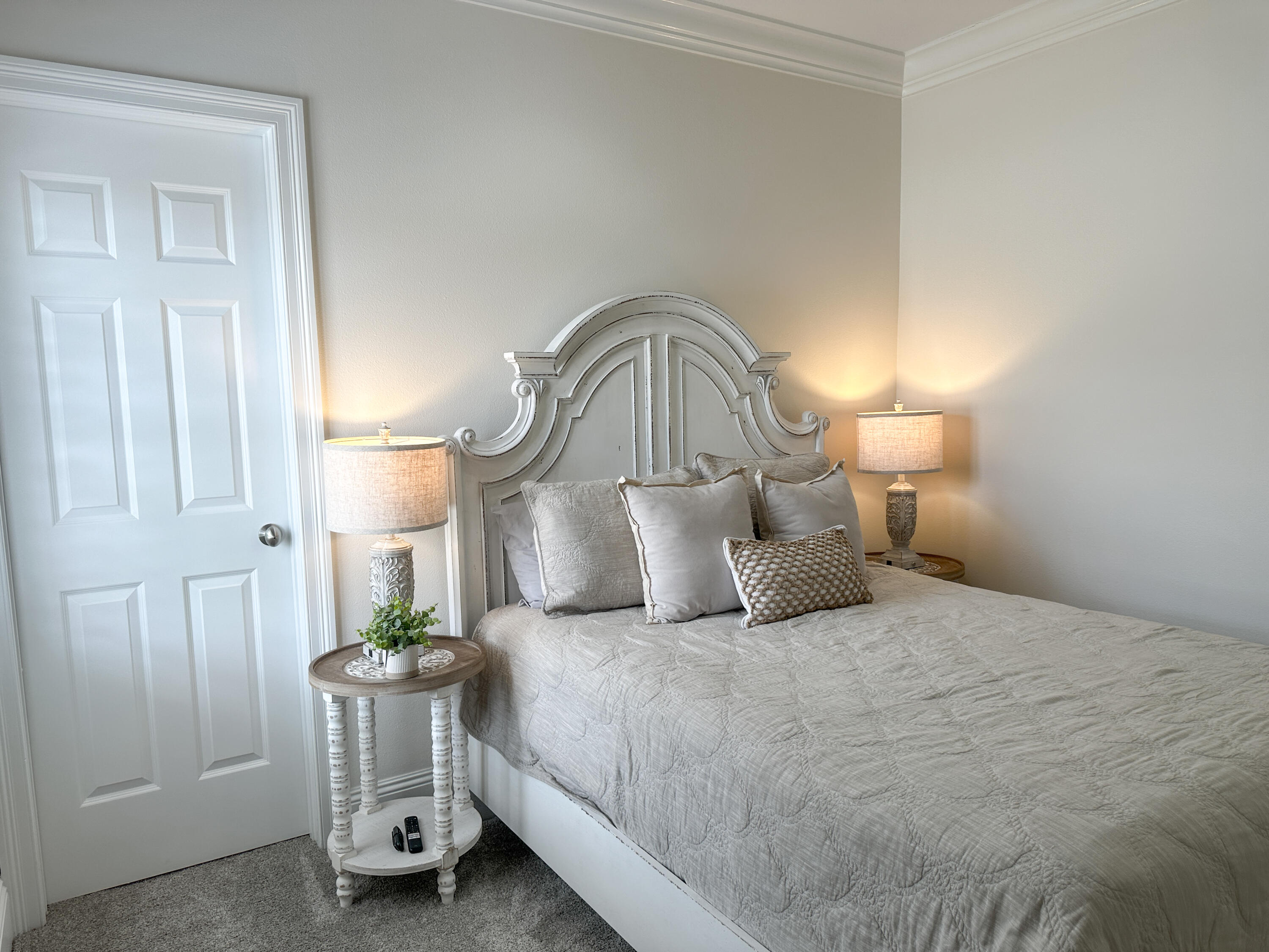 1893 Baytowne Loop Miramar Beach, FL 32550 - Photo 40 of 58 a bedroom with a bed a lamp and a window