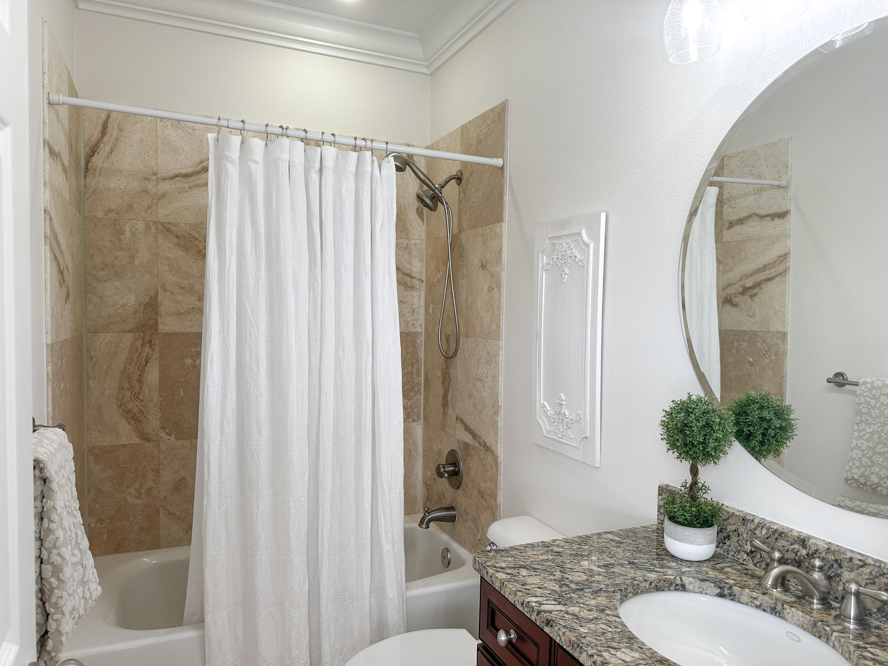 1893 Baytowne Loop Miramar Beach, FL 32550 - Photo 41 of 58 a bathroom with a granite countertop sink a toilet and shower