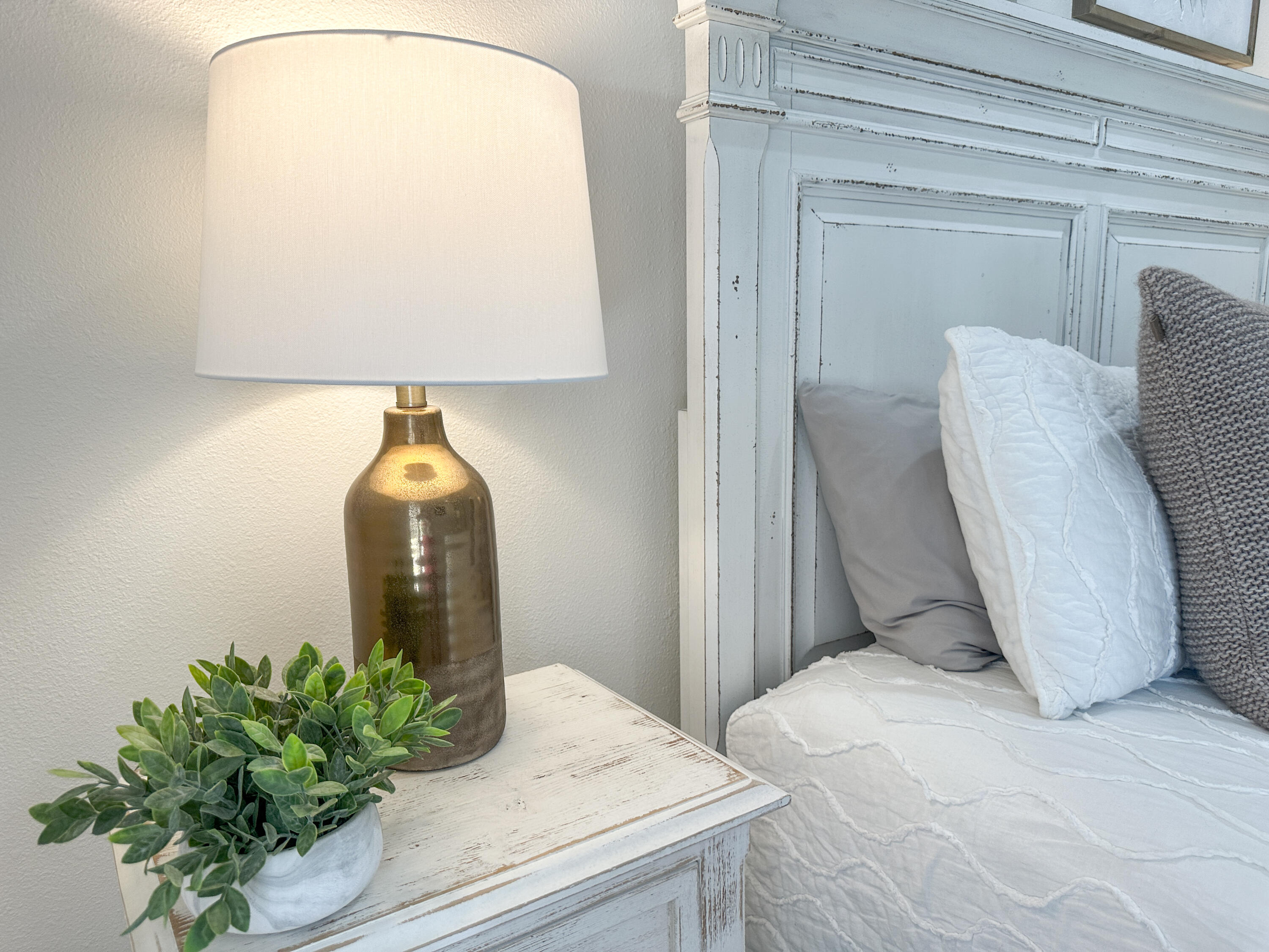 1893 Baytowne Loop Miramar Beach, FL 32550 - Photo 43 of 58 a bedroom with a bed and a potted plant