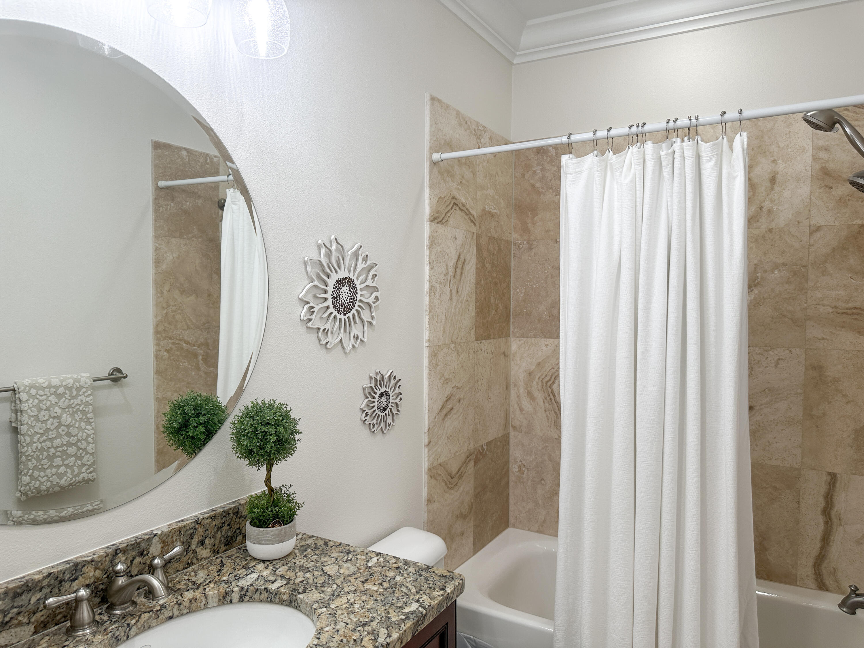 1893 Baytowne Loop Miramar Beach, FL 32550 - Photo 44 of 58 a bathroom with a granite countertop sink a mirror and a shower