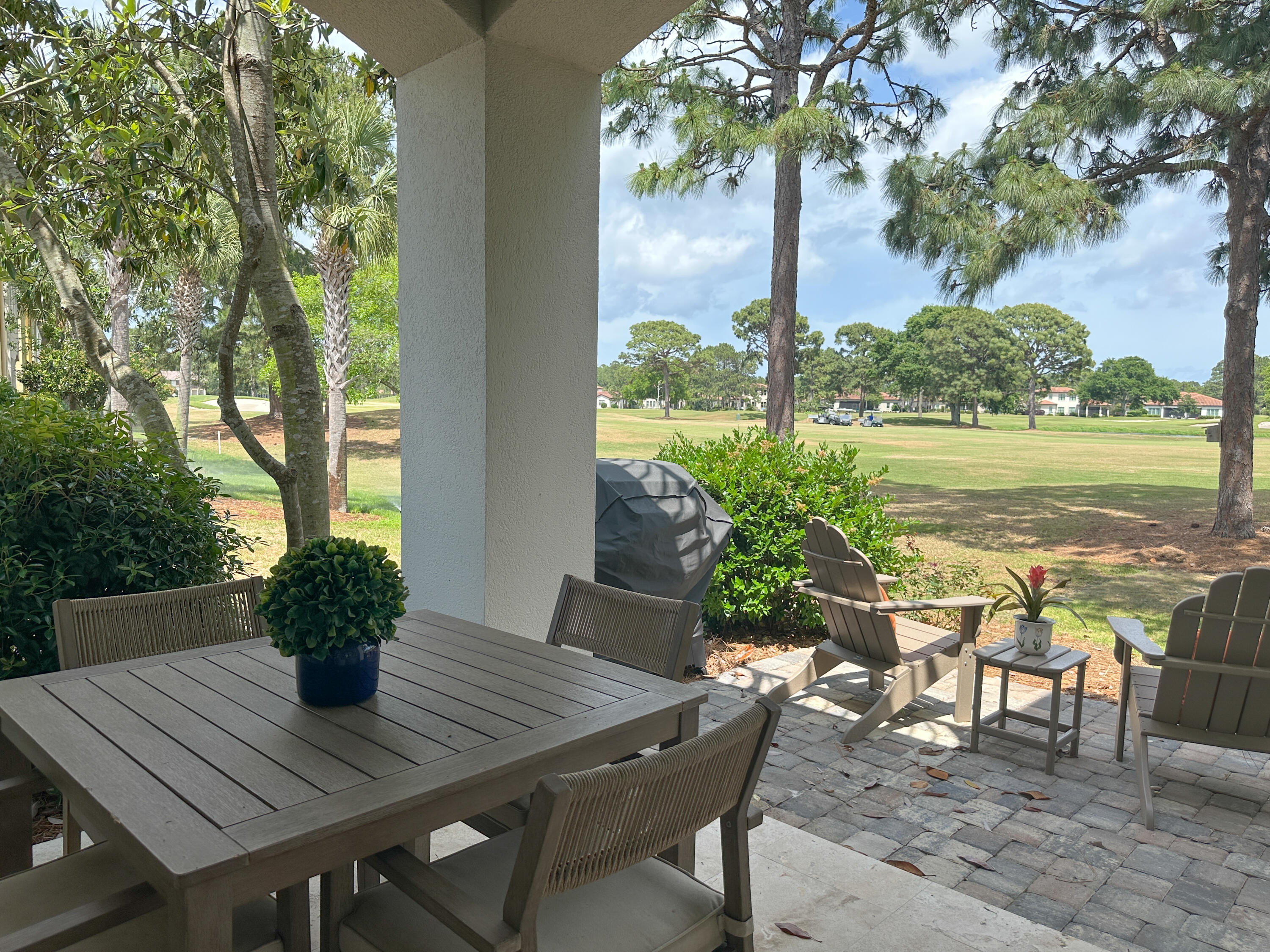 1893 Baytowne Loop Miramar Beach, FL 32550 - Photo 10 of 58 a view of a dining table and chairs on the deck