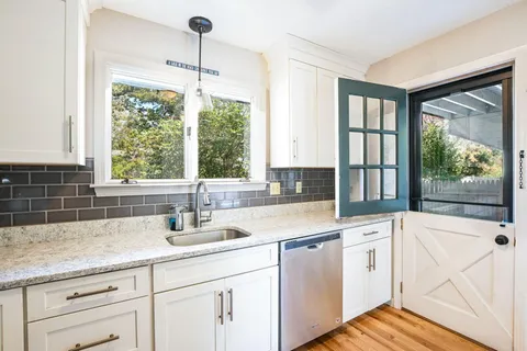a bathroom with a sink and mirror