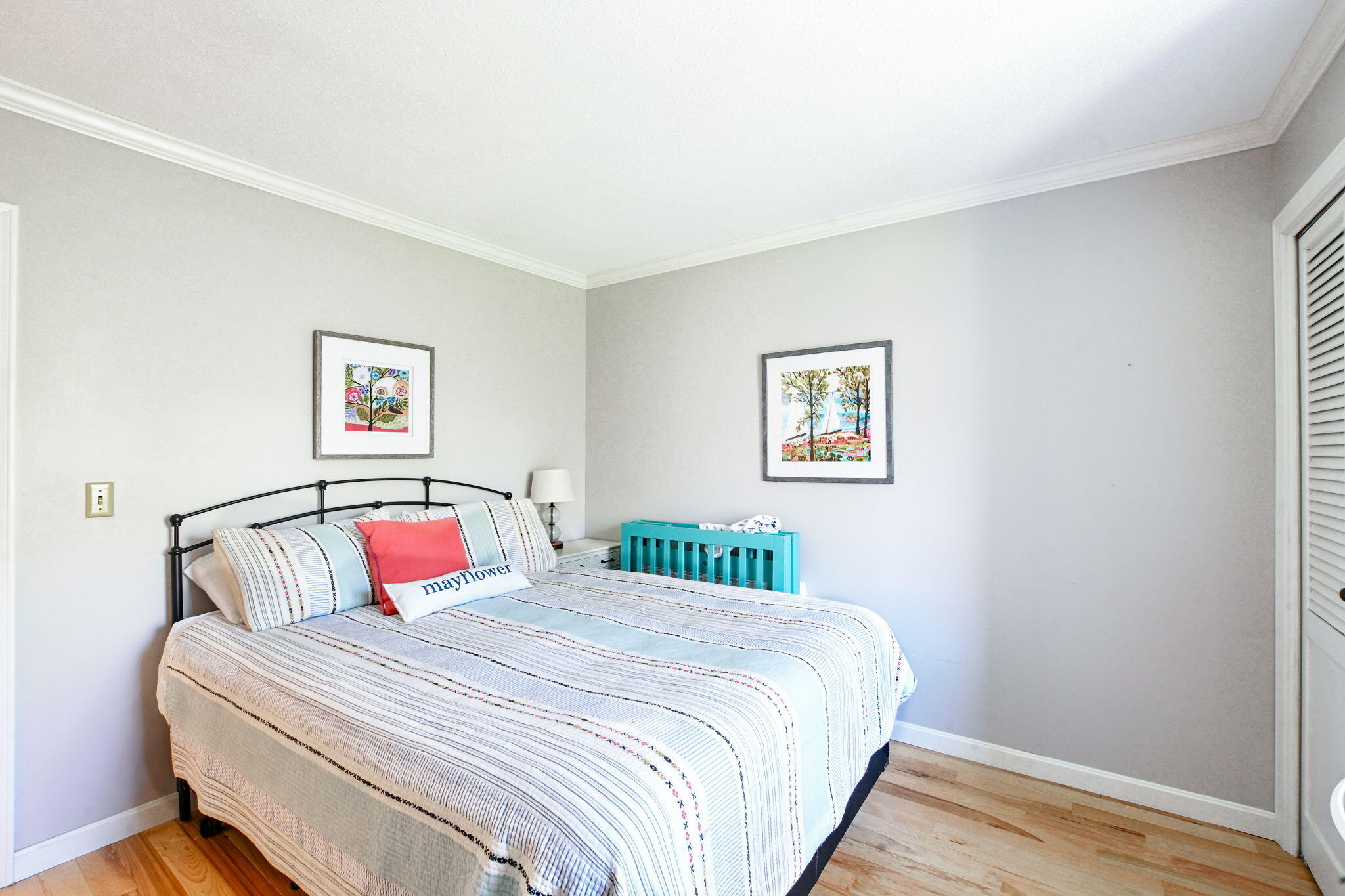 59 Main Street, Unit 20-3 Dennis, MA 02638 - Photo 18 of 40 a bedroom with a bed and a night stand