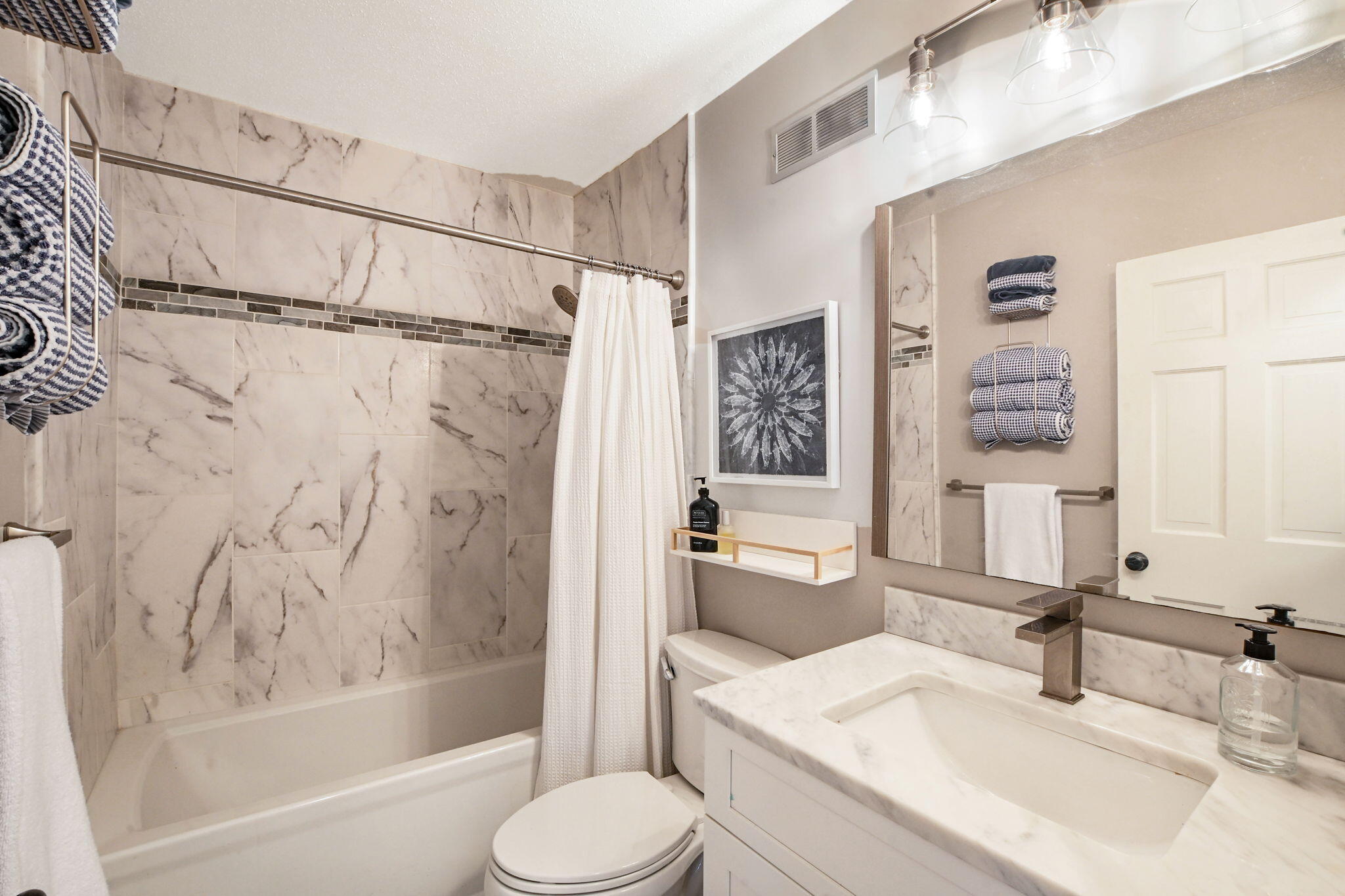 59 Main Street, Unit 20-3 Dennis, MA 02638 - Photo 20 of 40 a bathroom with a granite countertop sink toilet and shower