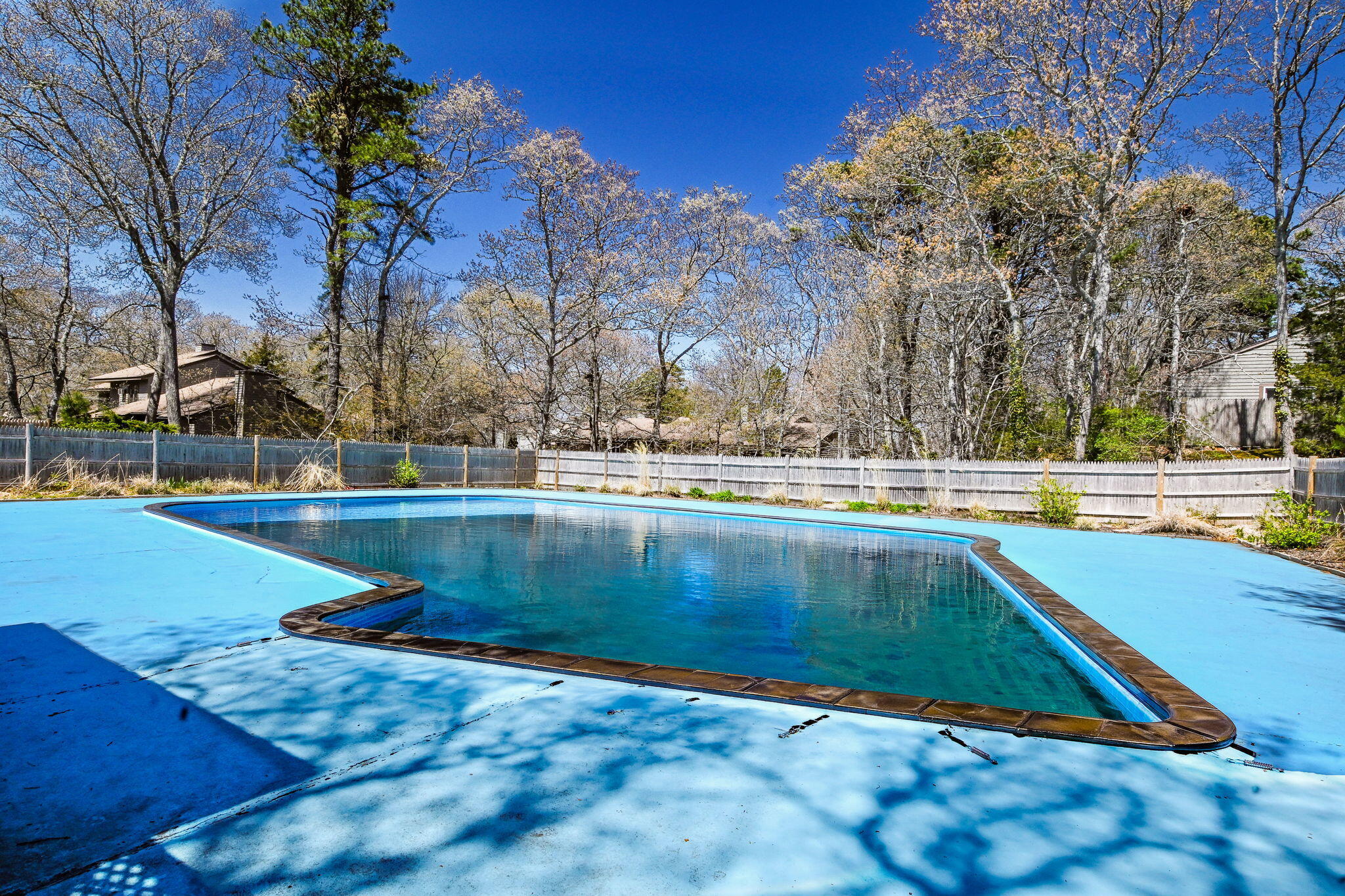 59 Main Street, Unit 20-3 Dennis, MA 02638 - Photo 29 of 40 a view of outdoor space with swimming pool and trees