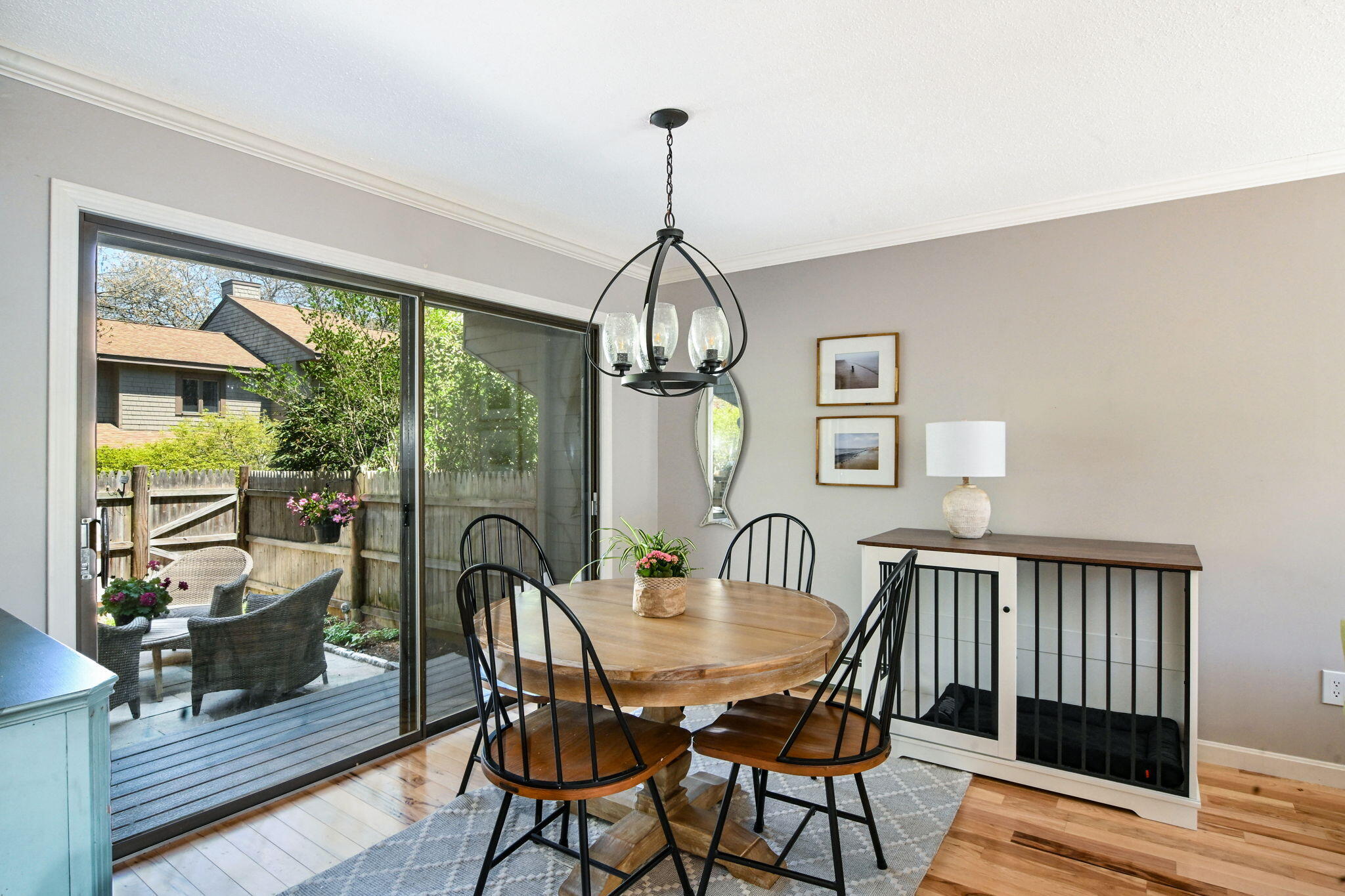 59 Main Street, Unit 20-3 Dennis, MA 02638 - Photo 5 of 40 a dining room with furniture a chandelier and wooden floor