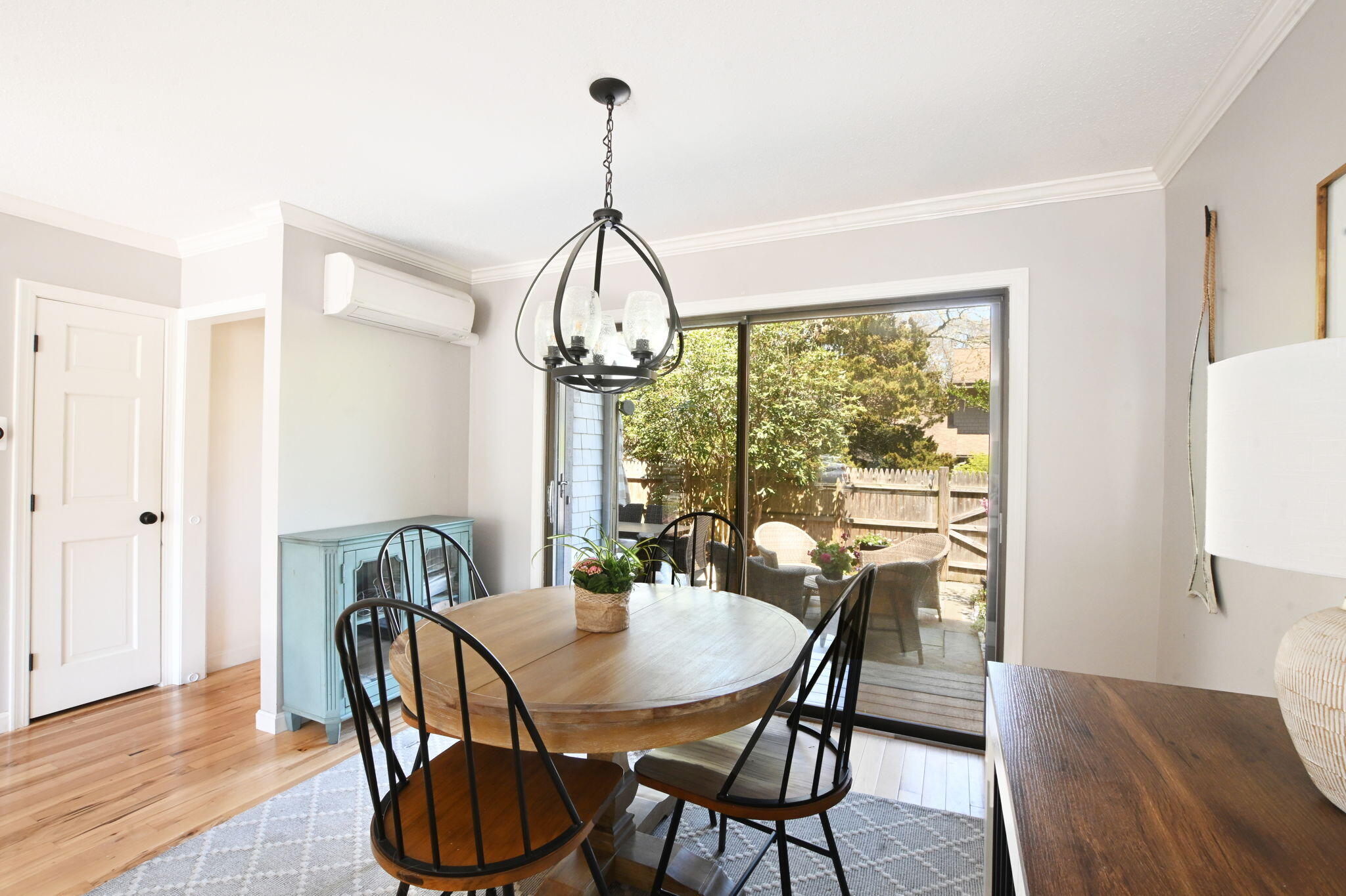 59 Main Street, Unit 20-3 Dennis, MA 02638 - Photo 6 of 40 a view of a dining room with furniture window and wooden floor