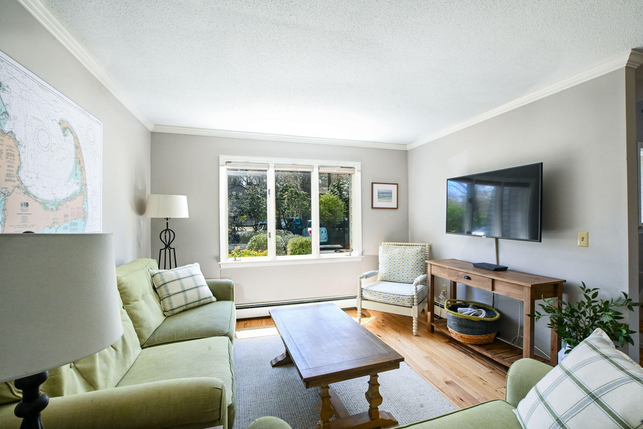 59 Main Street, Unit 20-3 Dennis, MA 02638 - Photo 7 of 40 a living room with furniture and a flat screen tv