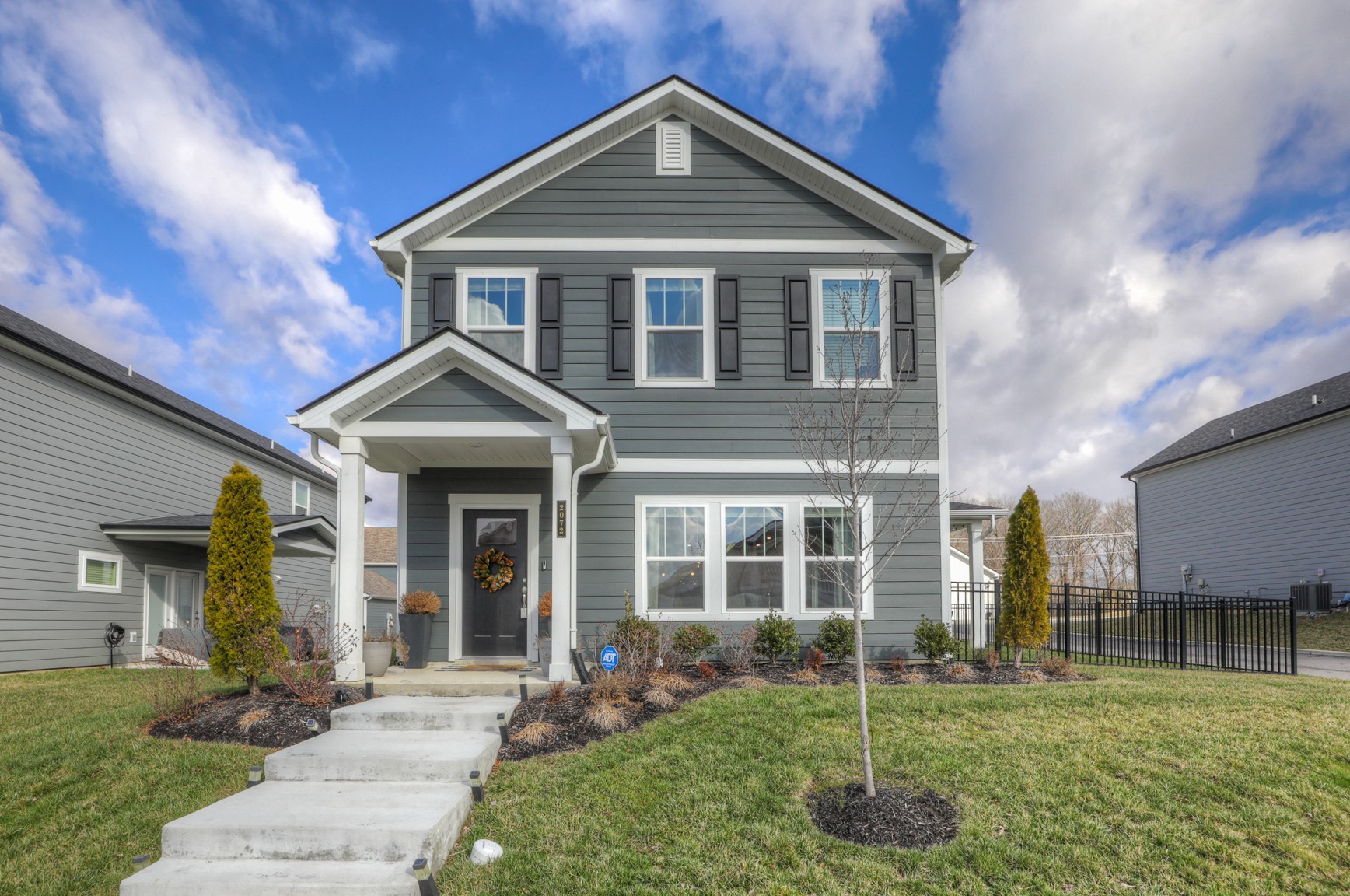 a front view of a house with a yard