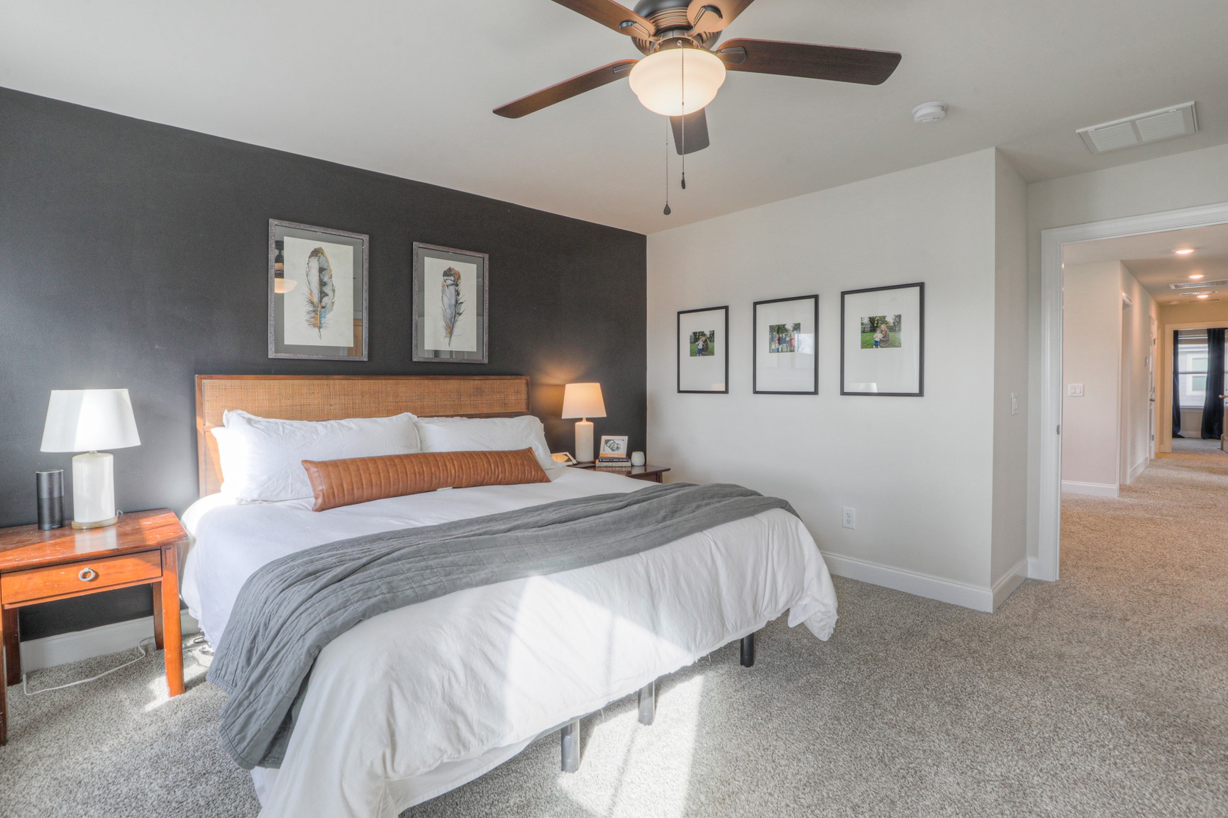 2072 Notchleaf Road Antioch, TN 37013 - Photo 13 of 30 a bedroom with a large bed and a chandelier