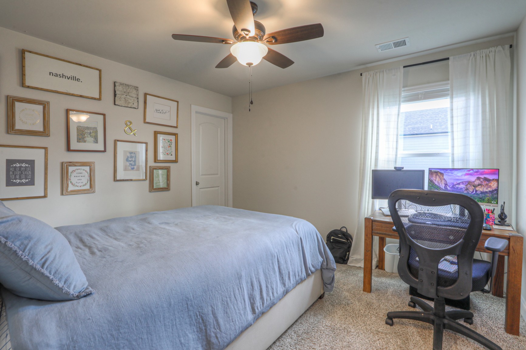2072 Notchleaf Road Antioch, TN 37013 - Photo 22 of 30 a bedroom with a bed a chair and a chandelier