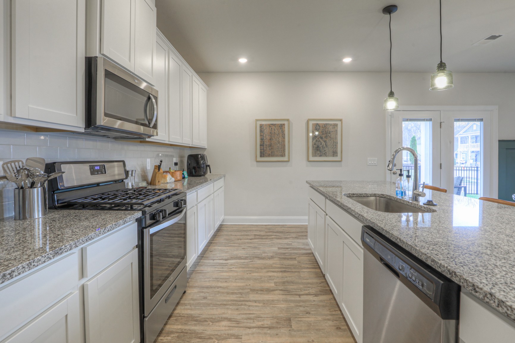 2072 Notchleaf Road Antioch, TN 37013 - Photo 7 of 30 a large kitchen with stainless steel appliances granite countertop a stove a sink and a microwave