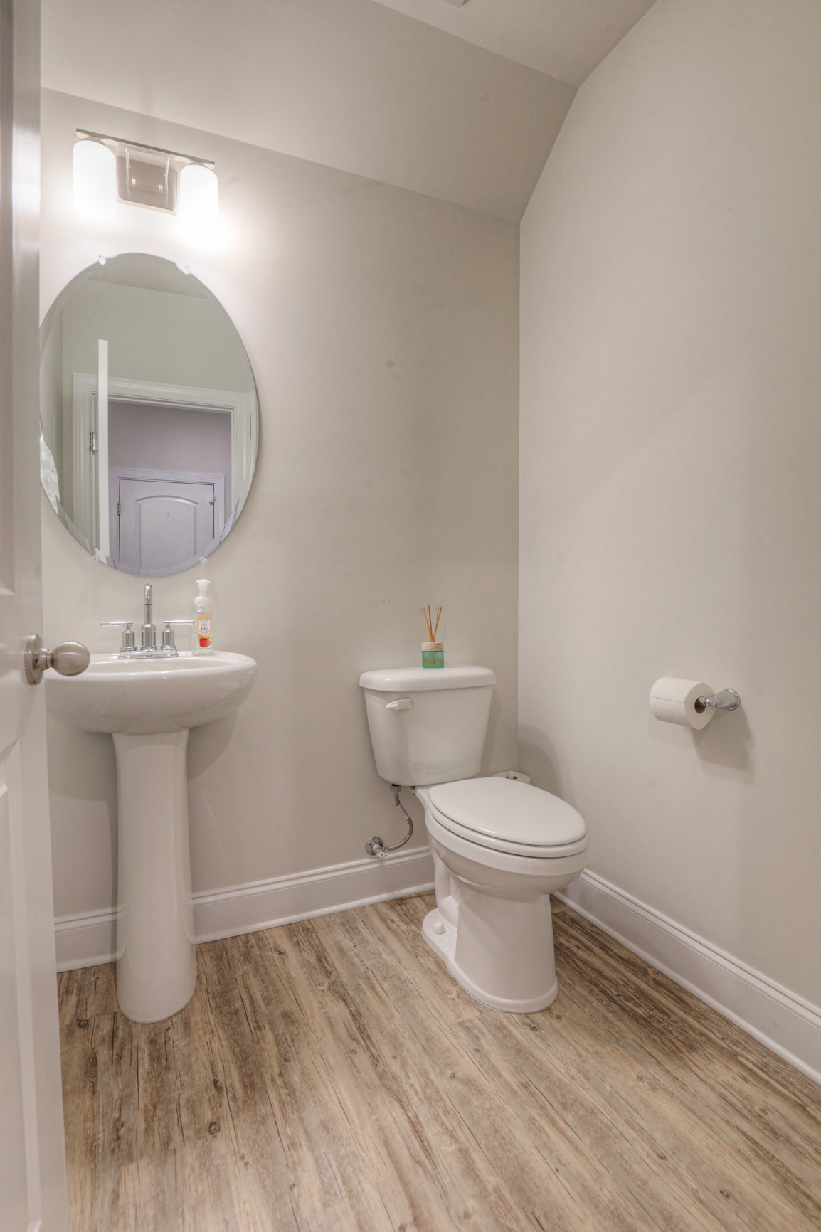 2072 Notchleaf Road Antioch, TN 37013 - Photo 9 of 30 a bathroom with a toilet a sink and mirror