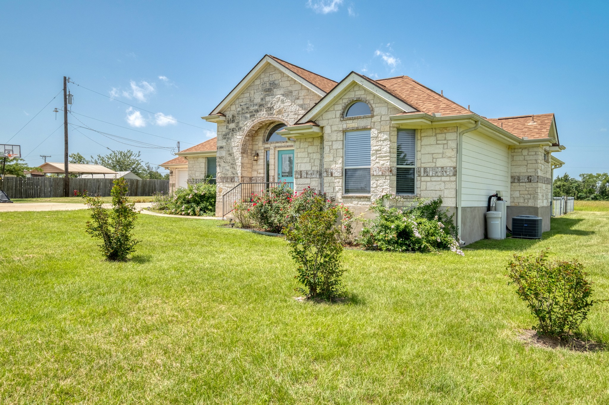 341 Brown Road McDade, TX 78650 - Photo 2 of 38 A cream brick facade with an arched entry invites discovery of this charming property.