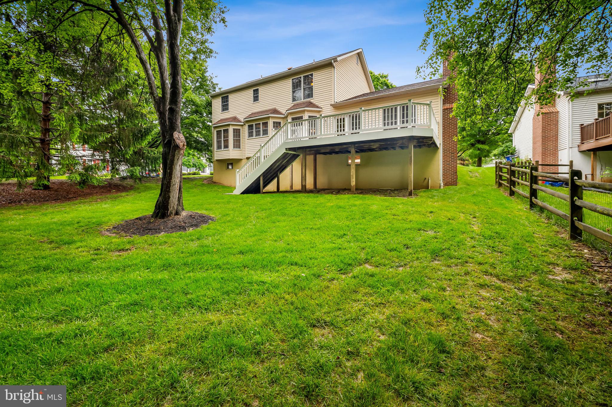 6902 Raven Lane Columbia, MD 21044 - Photo 21 of 47 a view of a house with a yard deck and a large tree