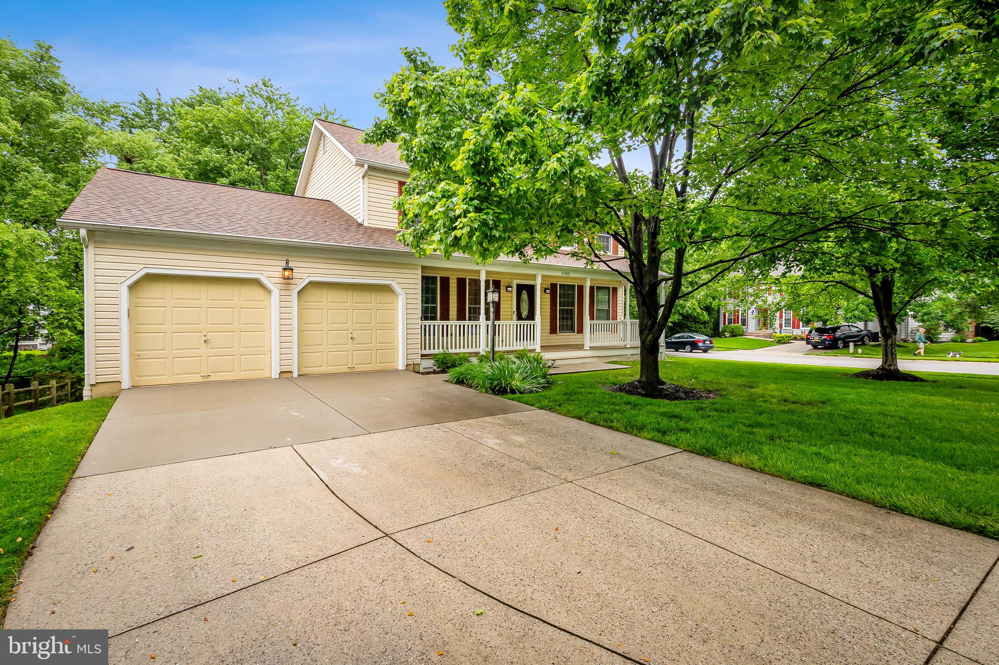 6902 Raven Lane Columbia, MD 21044 - Photo 43 of 47 a view of a white house with a yard