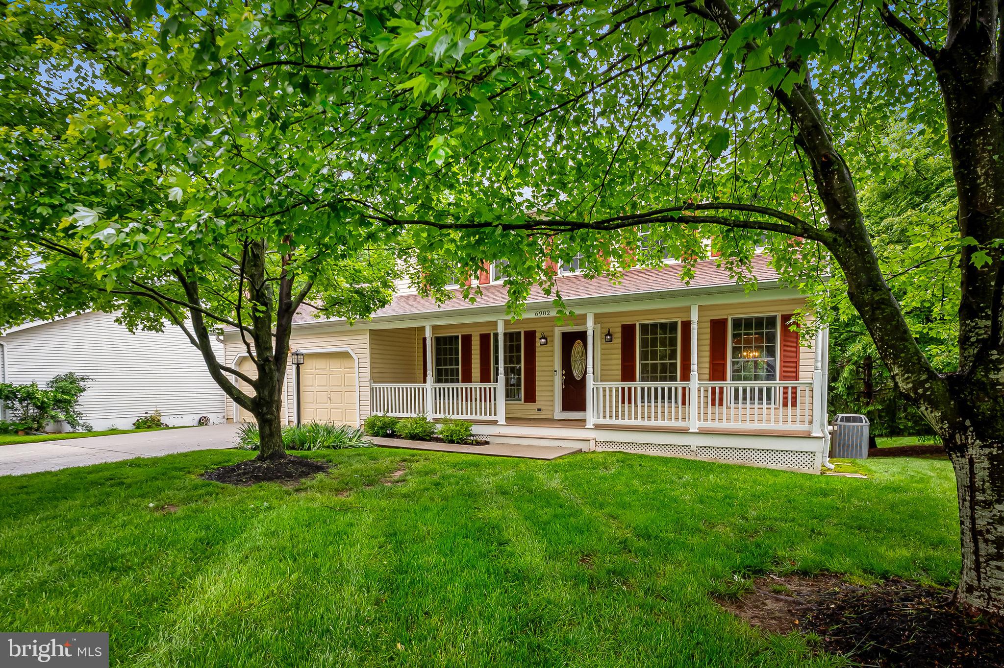 6902 Raven Lane Columbia, MD 21044 - Photo 44 of 47 a view of a house with a yard deck and a large tree