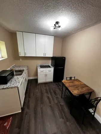 a room with furniture and a wooden floor