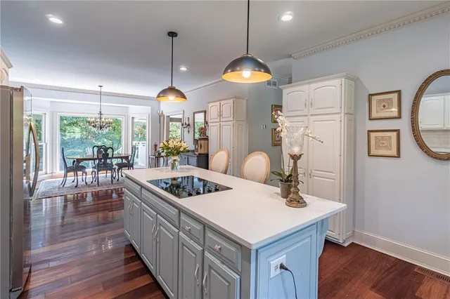 a spacious bedroom with a bed and a fireplace