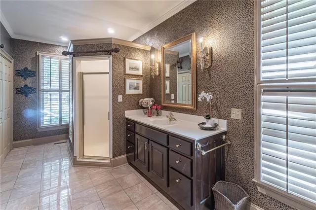 a bathroom with a mirror a sink and a mirror