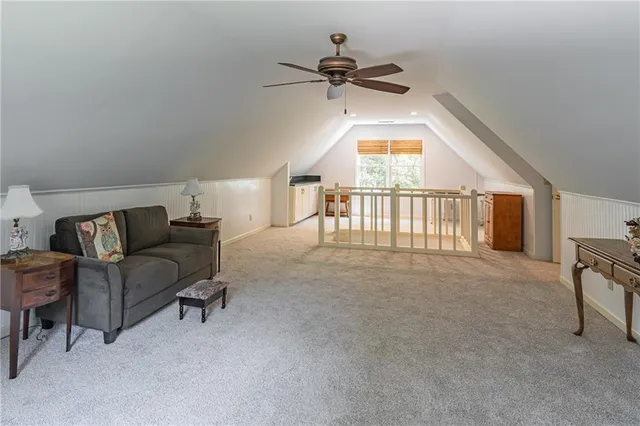 a bedroom with a bed dresser and a window