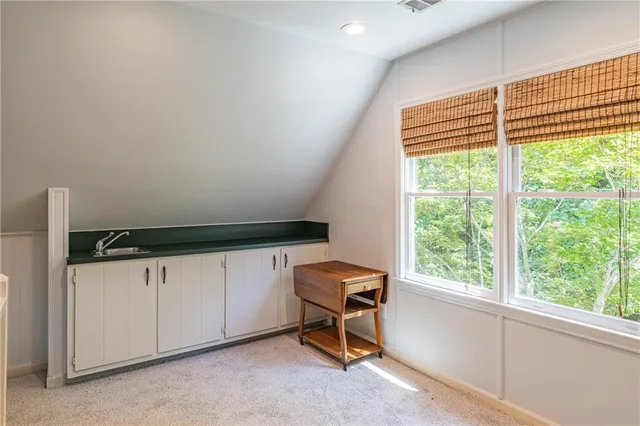 a en suite bathroom with a sink and a mirror