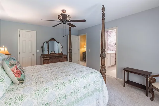 a view of a chair and table in the garden