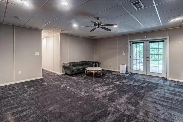 a big yard with lots of green space and trees