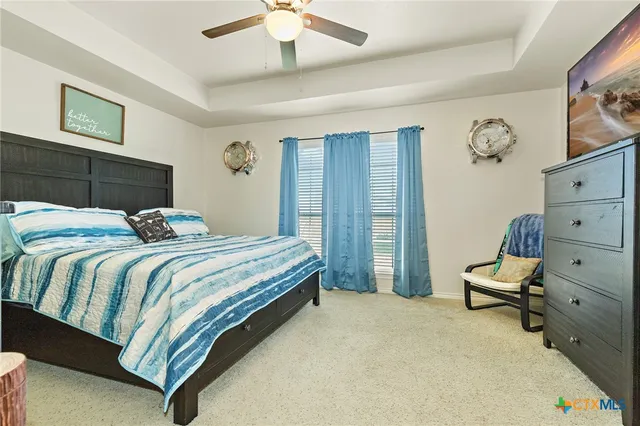 a bedroom with a bed and lamp