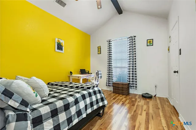 a bedroom with a bed and a table