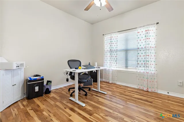 a workspace with furniture and a window
