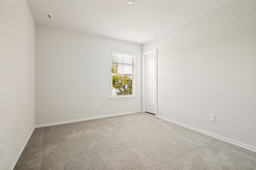 621 Spaulding Street Justin, TX 76247 - Photo 12 of 22 an empty room with windows