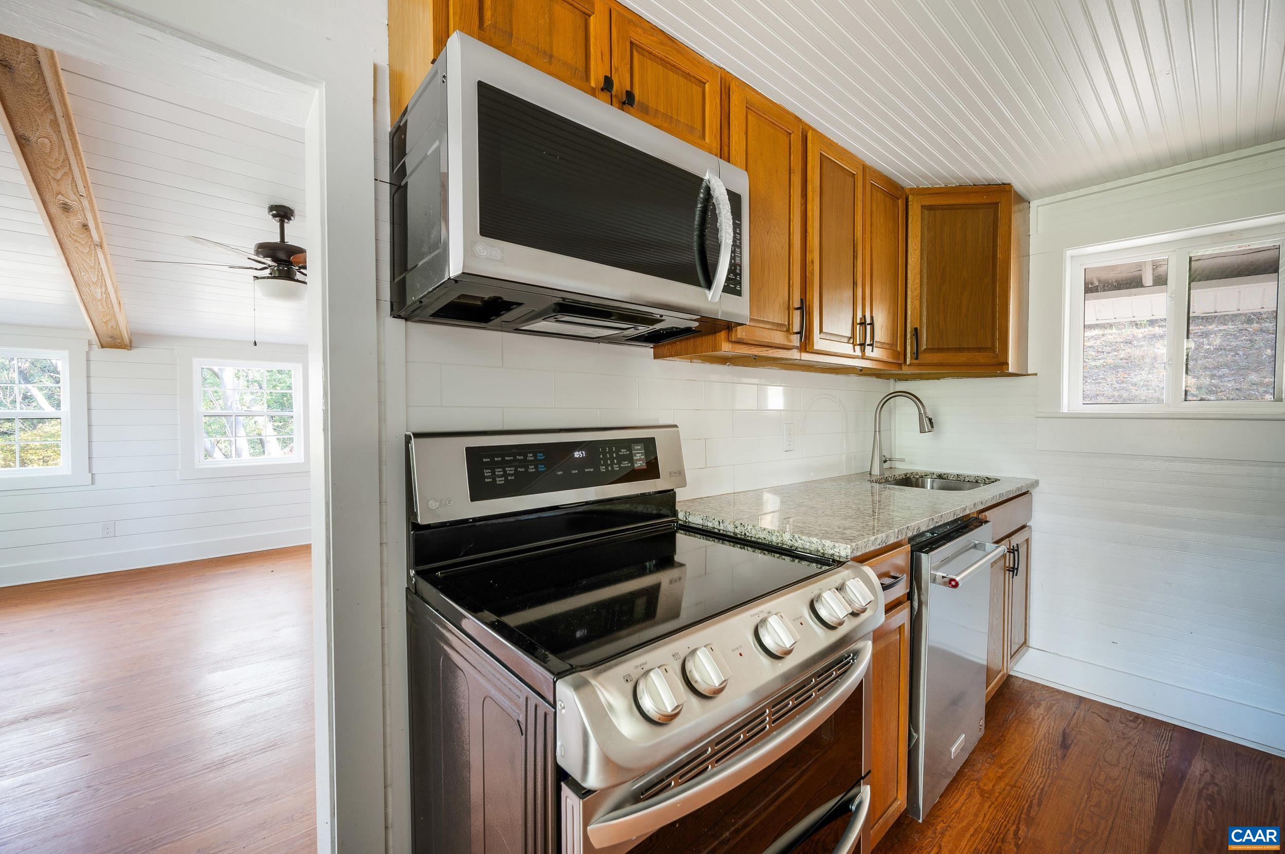 2728 East Branch Loop Roseland, VA 22967 - Photo 11 of 45 a kitchen with a stove and a microwave