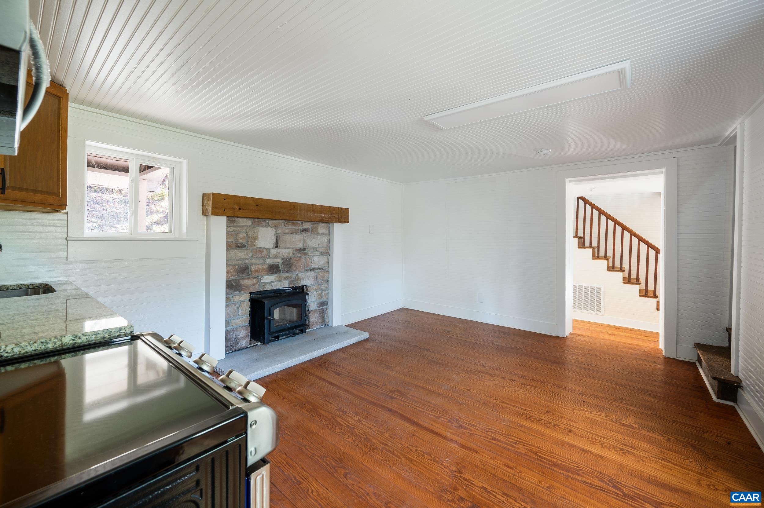 2728 East Branch Loop Roseland, VA 22967 - Photo 12 of 45 a kitchen with a stove and a fireplace
