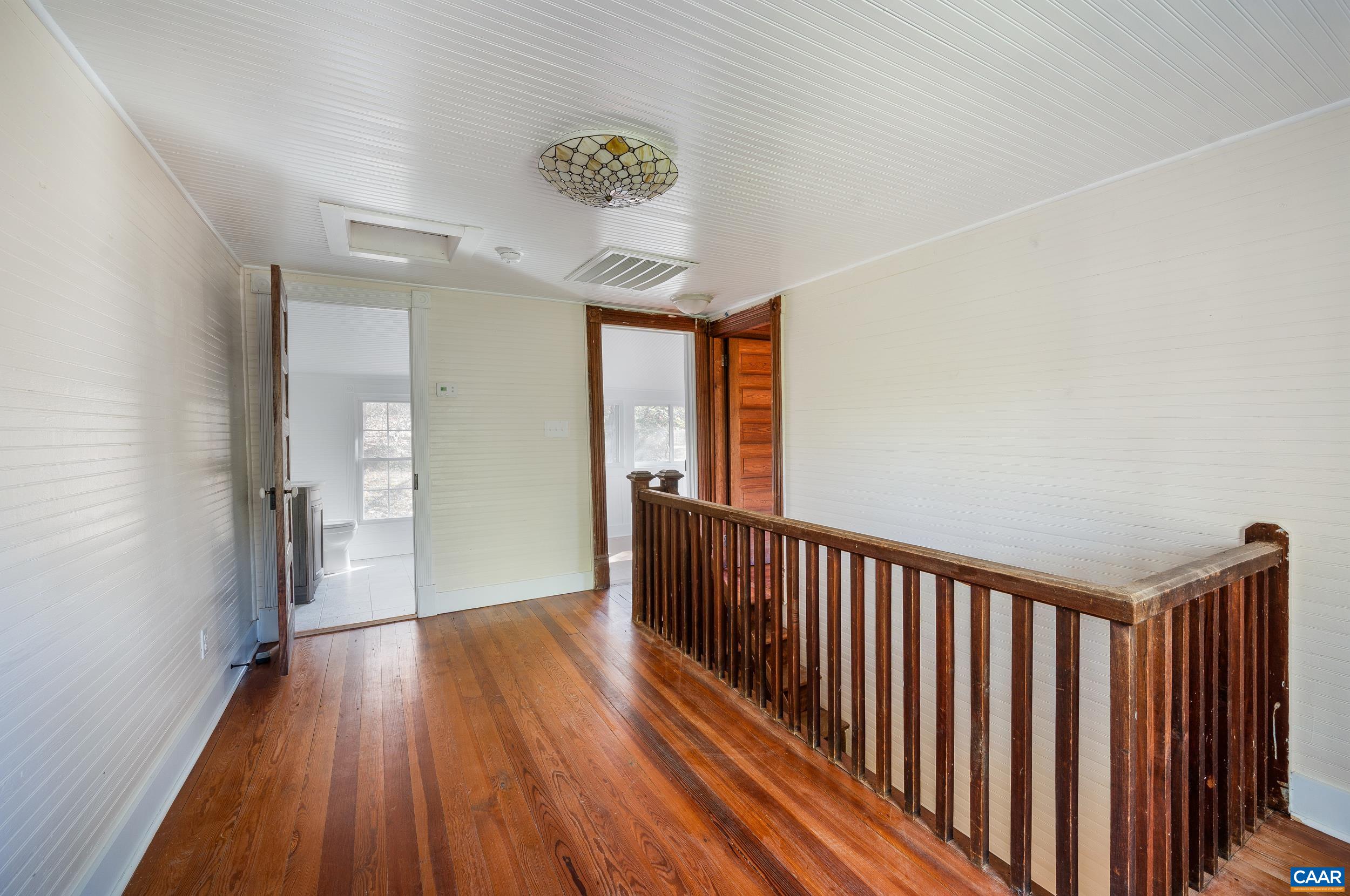 2728 East Branch Loop Roseland, VA 22967 - Photo 17 of 45 a view of hallway with wooden floor