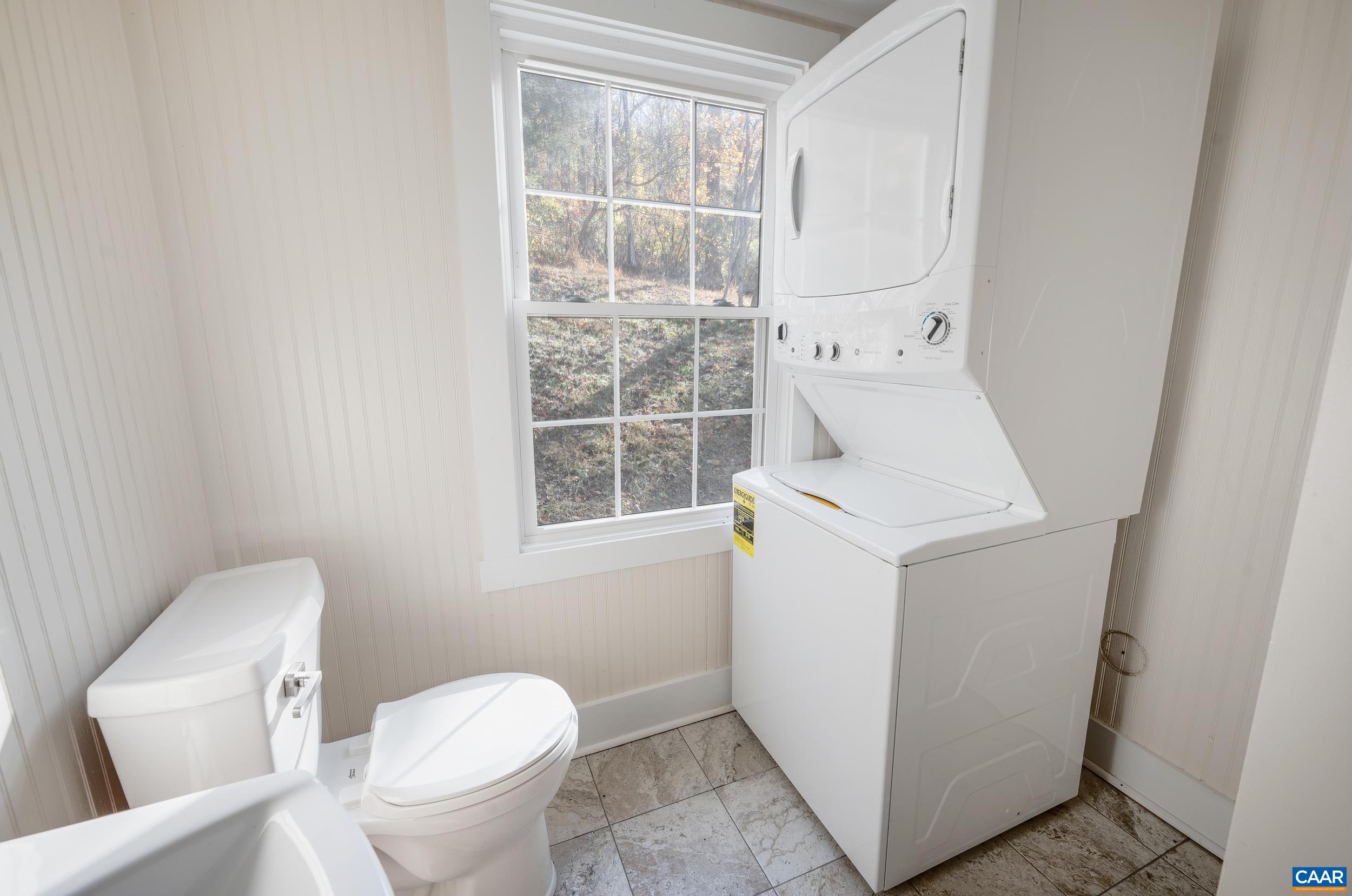 2728 East Branch Loop Roseland, VA 22967 - Photo 20 of 45 a white toilet sitting next to a bathroom sink