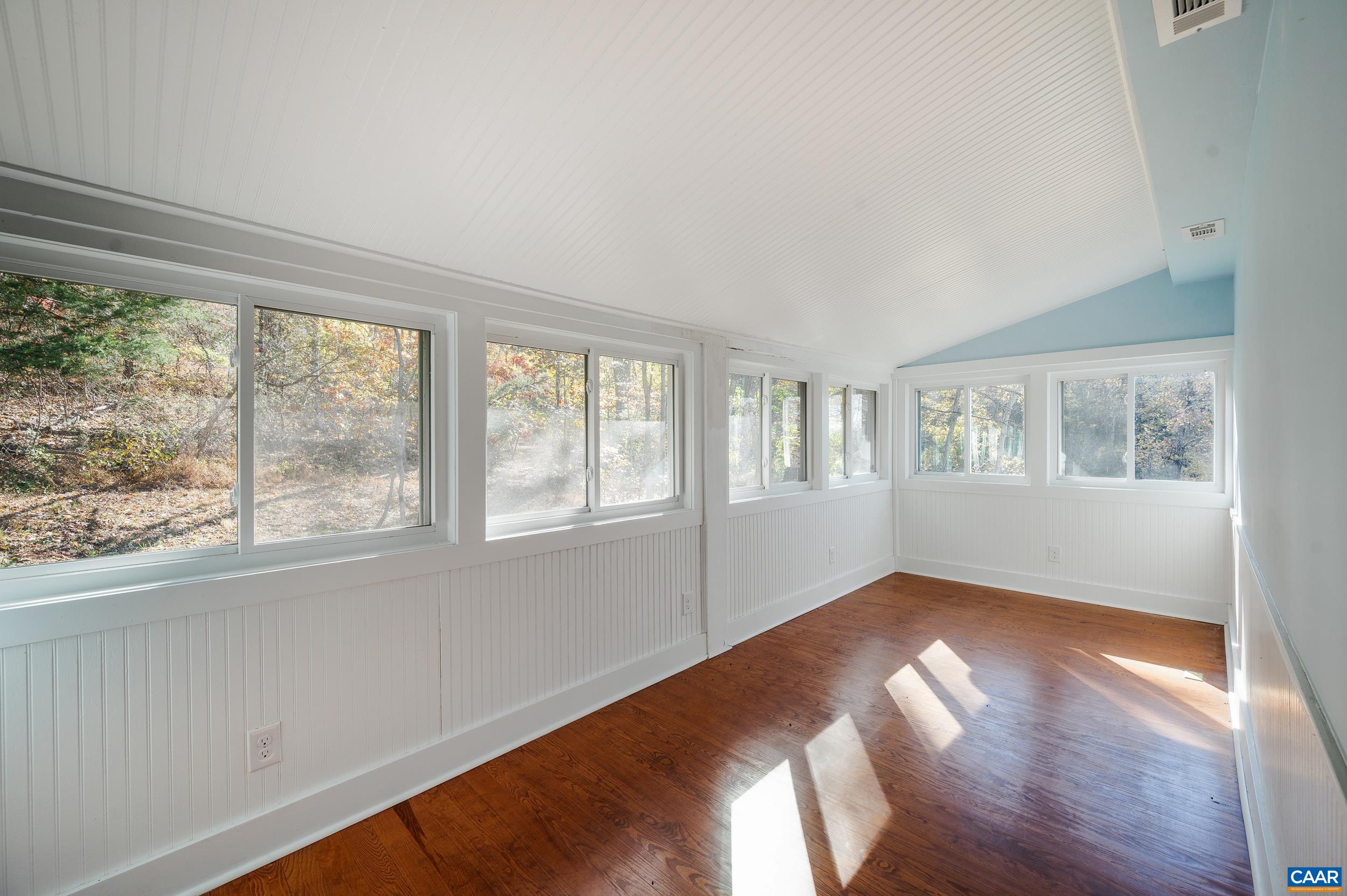 2728 East Branch Loop Roseland, VA 22967 - Photo 24 of 45 a view of an empty room with wooden floor and a window
