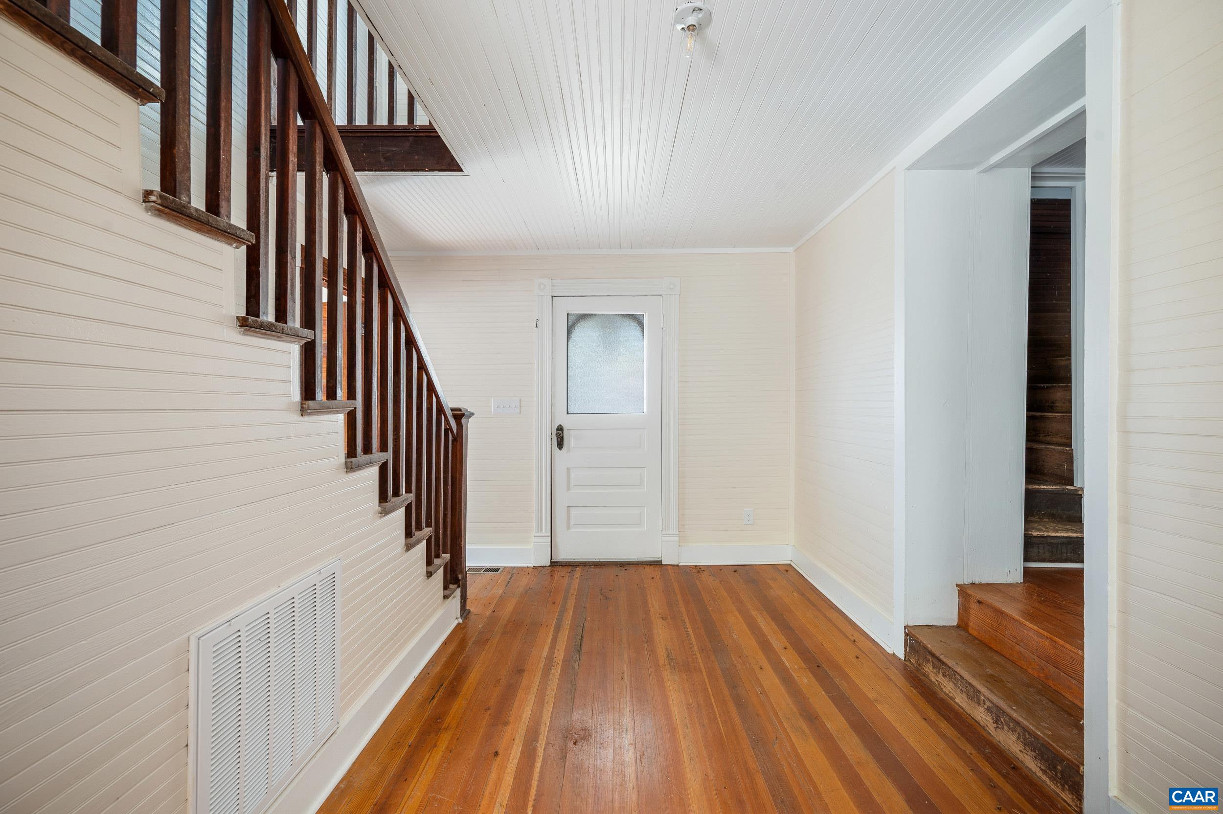 2728 East Branch Loop Roseland, VA 22967 - Photo 5 of 45 a view of a hallway with wooden floor and staircase