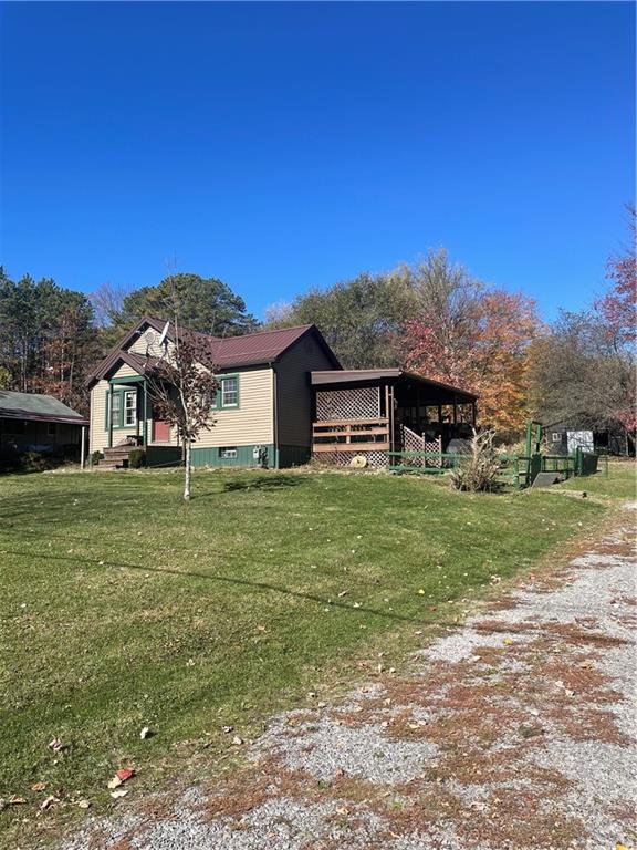257 Boyers Road Harrisville, PA 16038 - Photo 2 of 4 a front view of a house with a yard