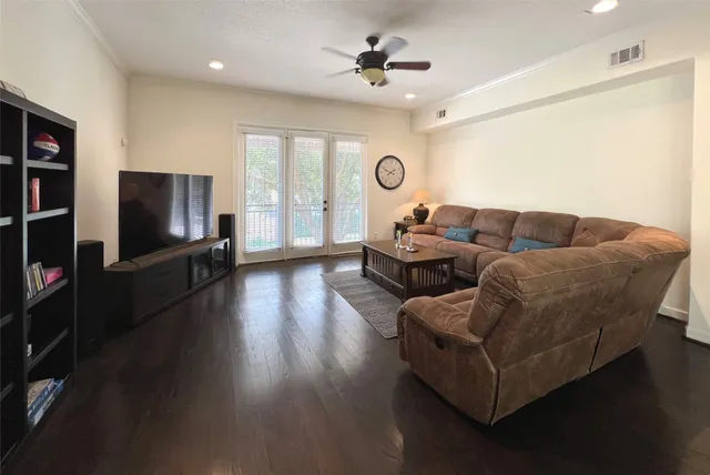 a living room with fireplace furniture and a flat screen tv