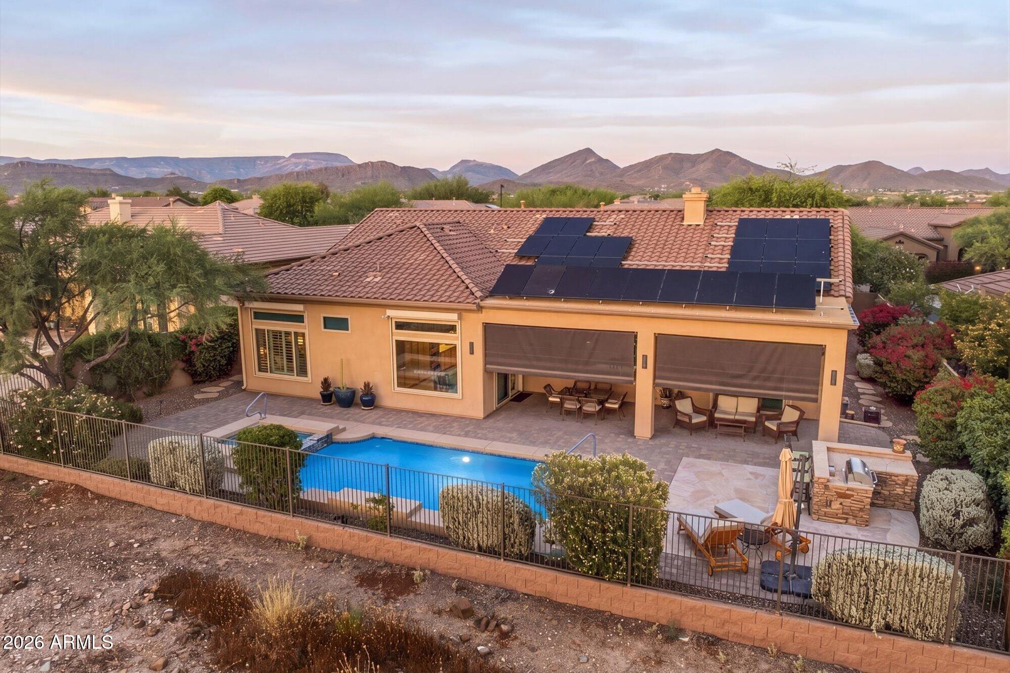 40322 North Hawk Ridge Trail Anthem, AZ 85086 - Photo 54 of 63 a view of a patio with couches near an umbrella