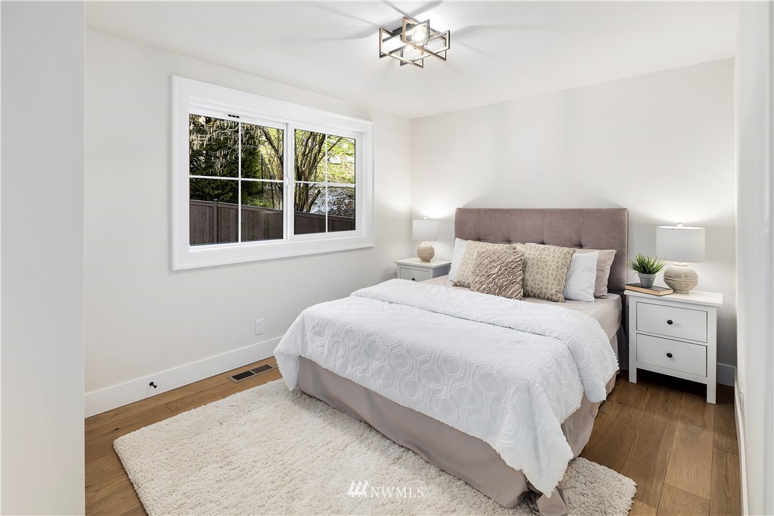 12106 Southeast 26th Street Bellevue, WA 98005 - Photo 27 of 32 a bedroom with a large bed and a window